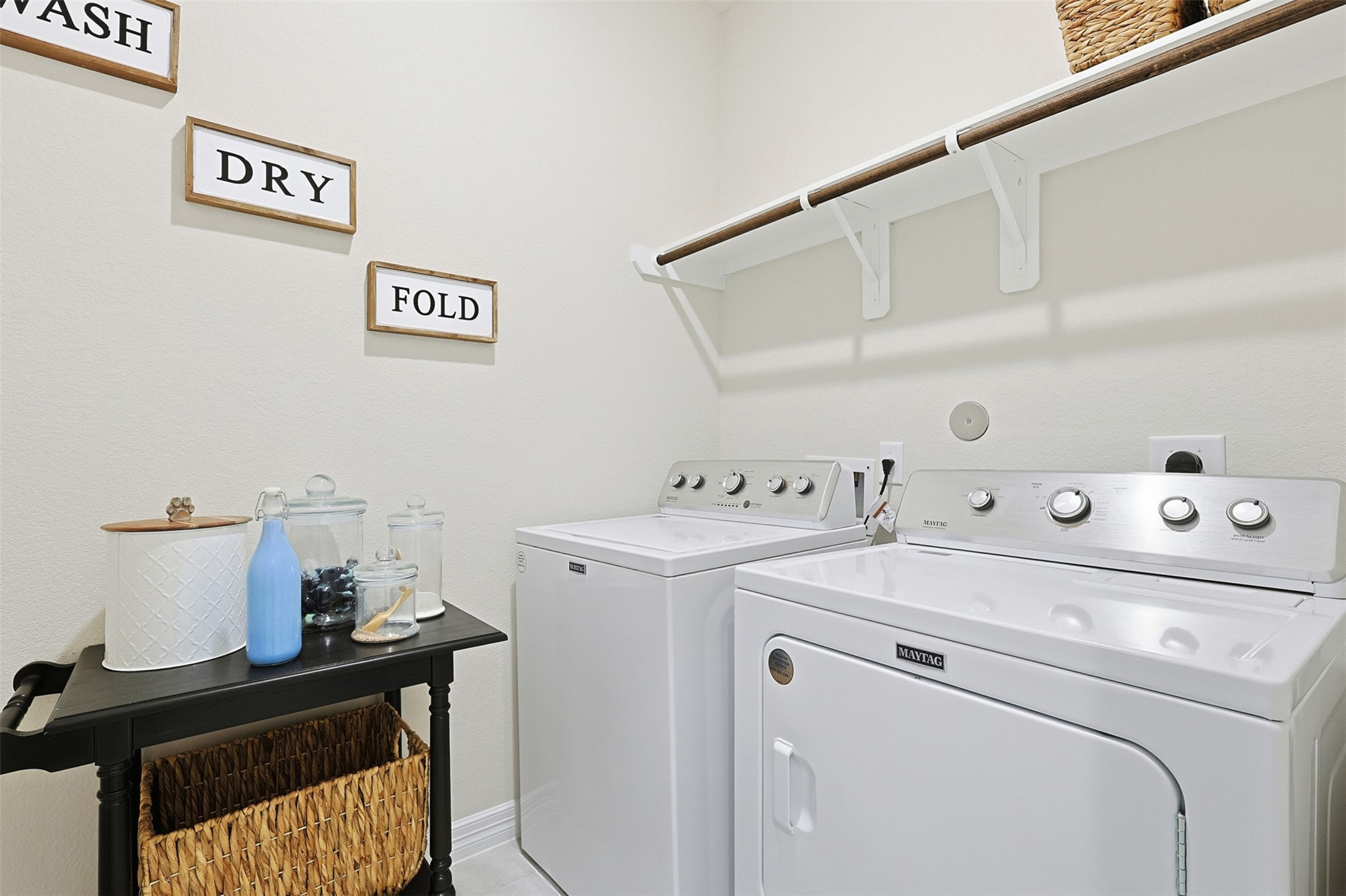 2773 Bluebonnet Ridge Drive Conroe, TX 77304 - Photo 14 of 23 a view of washer and dryer with kitchen in the background