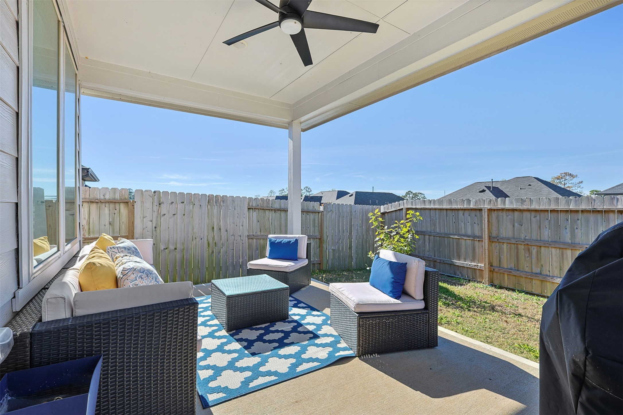2773 Bluebonnet Ridge Drive Conroe, TX 77304 - Photo 15 of 23 a living room with furniture a rug and a chandelier