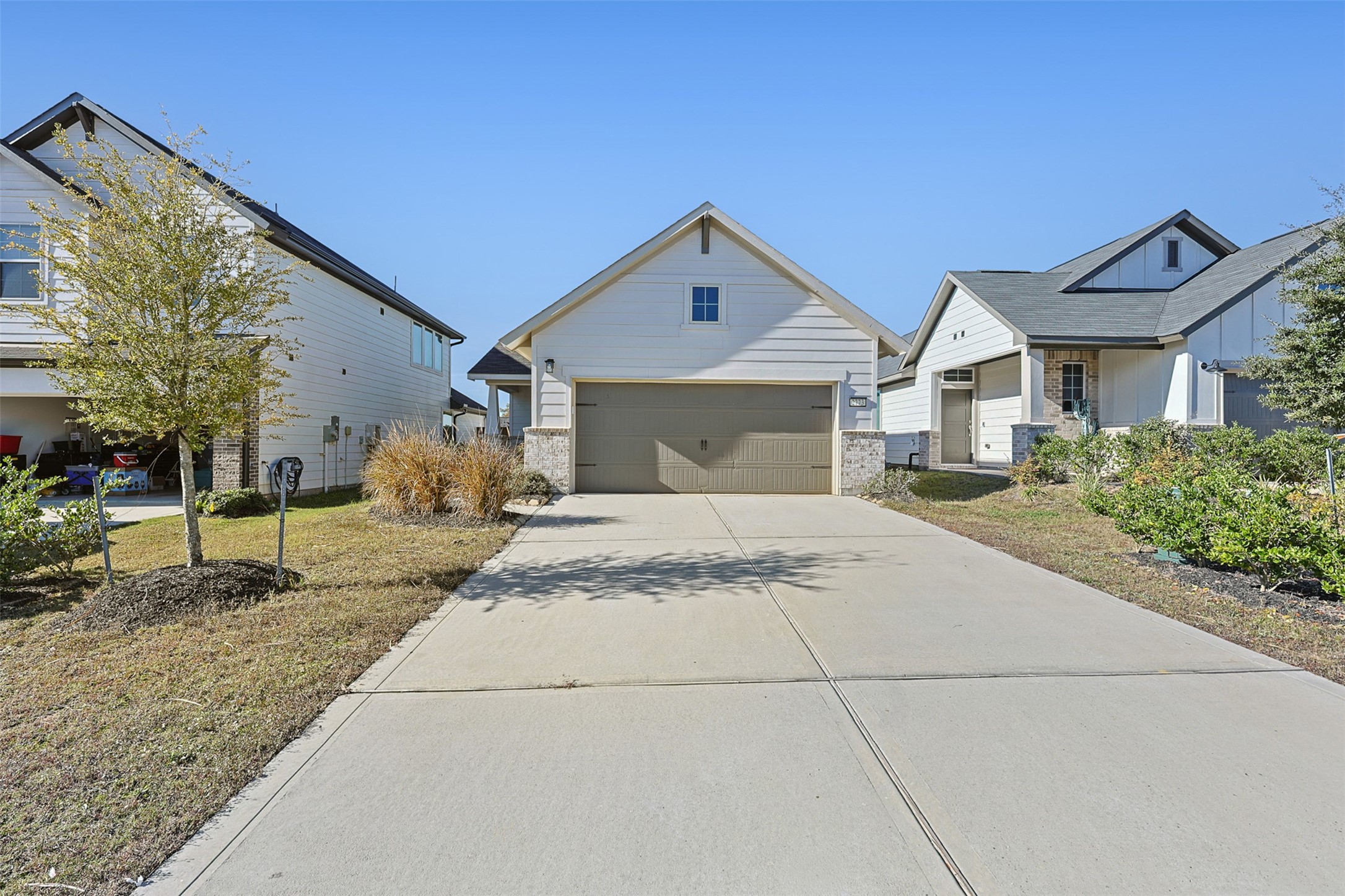 2773 Bluebonnet Ridge Drive Conroe, TX 77304 - Photo 18 of 23 a front view of a house with garden