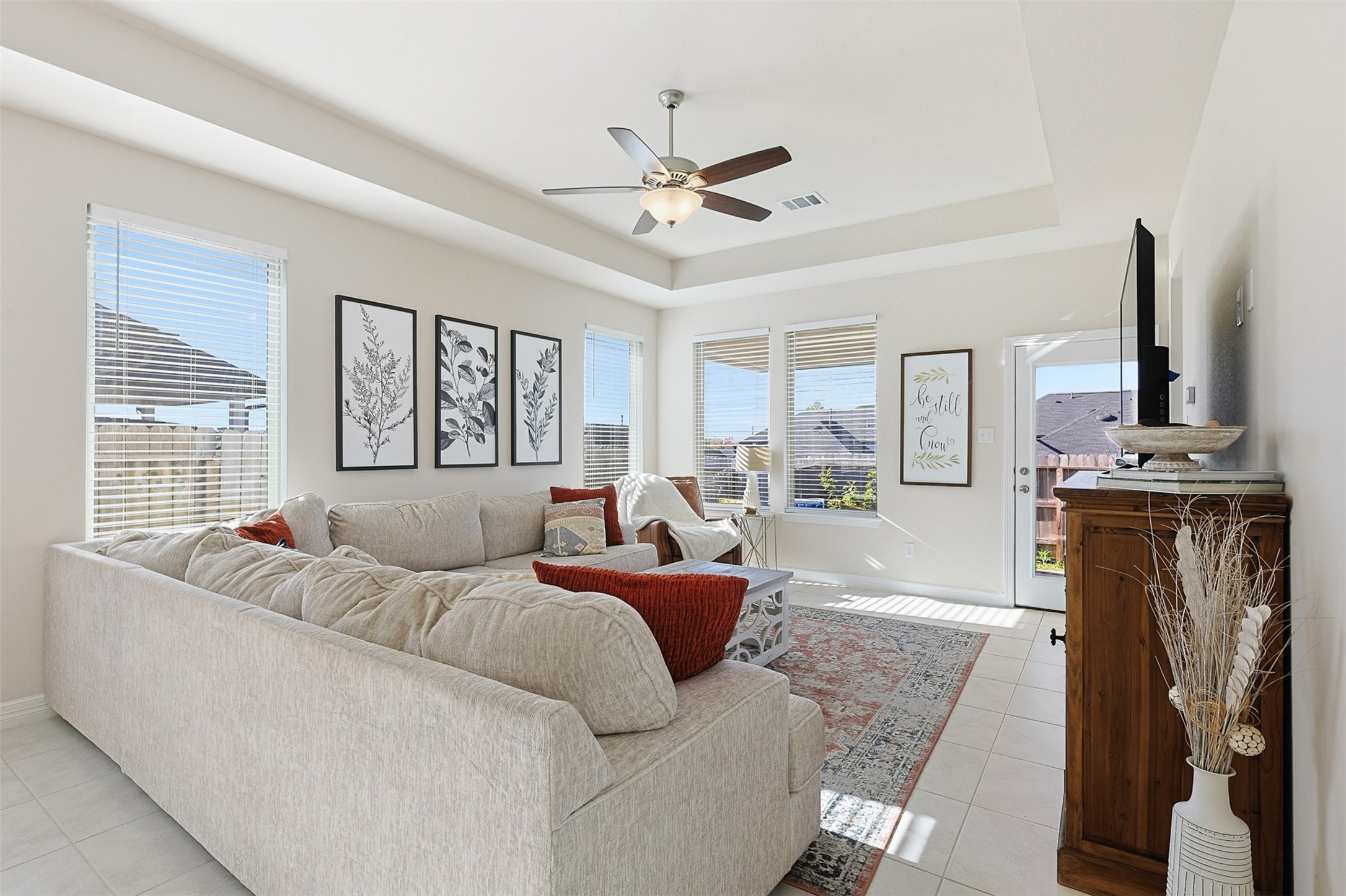 2773 Bluebonnet Ridge Drive Conroe, TX 77304 - Photo 6 of 23 a living room with furniture a fireplace and a flat screen tv