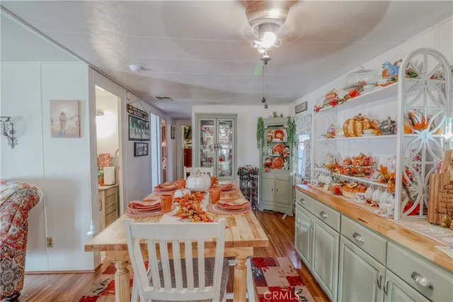 a view of a dining room with furniture kitchen and wooden floor
