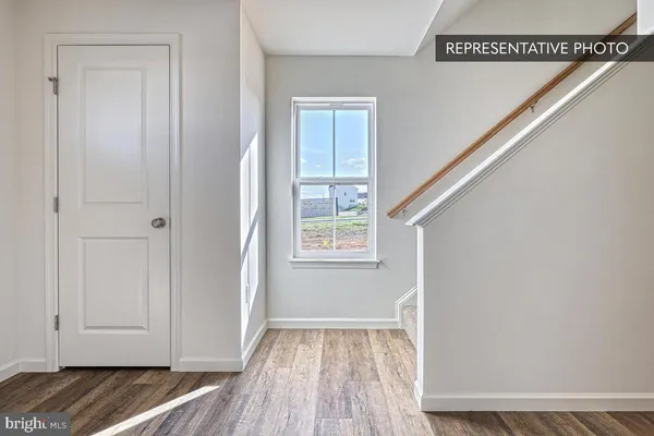 a view of livingroom with hardwood floor and hallway