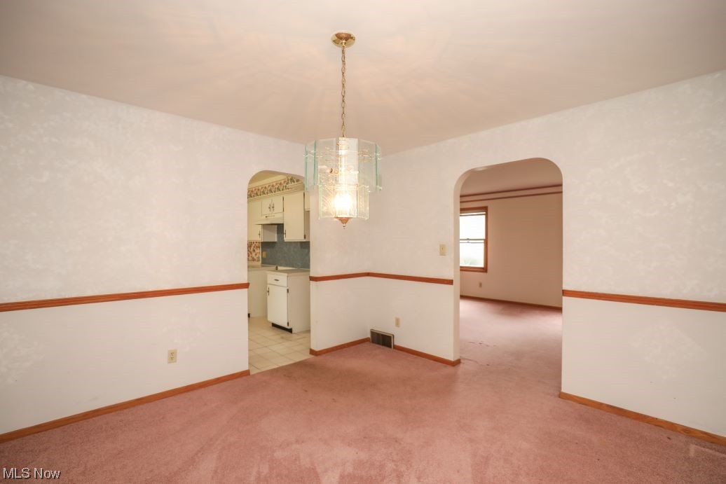 3143 Sandy Lake Road Ravenna, OH 44266 - Photo 17 of 35 Empty room with light carpet