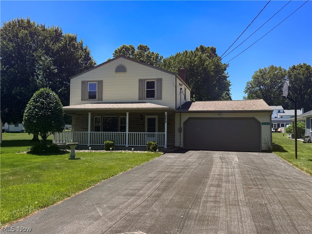 6666 Clingan Road Youngstown, OH 44514 - Photo 2 of 41 Two-story residence featuring light-colored siding and a covered front porch with white railing