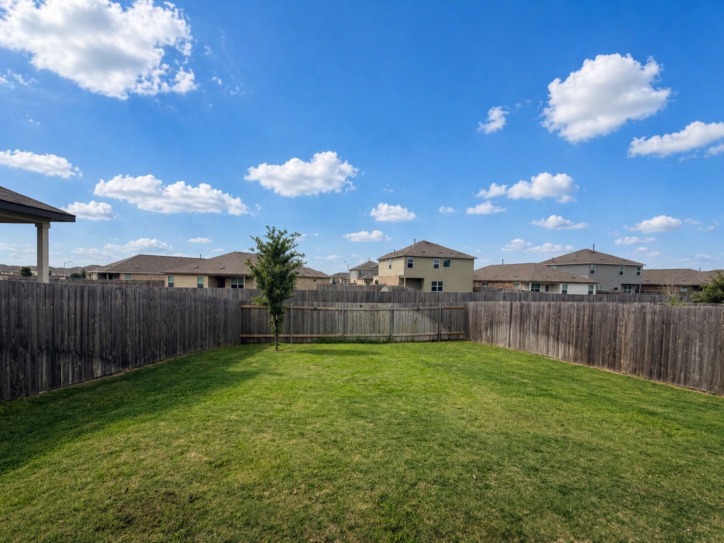 400 Canley Loop Hutto, TX 78634 - Photo 19 of 20 a view of a backyard with a fence