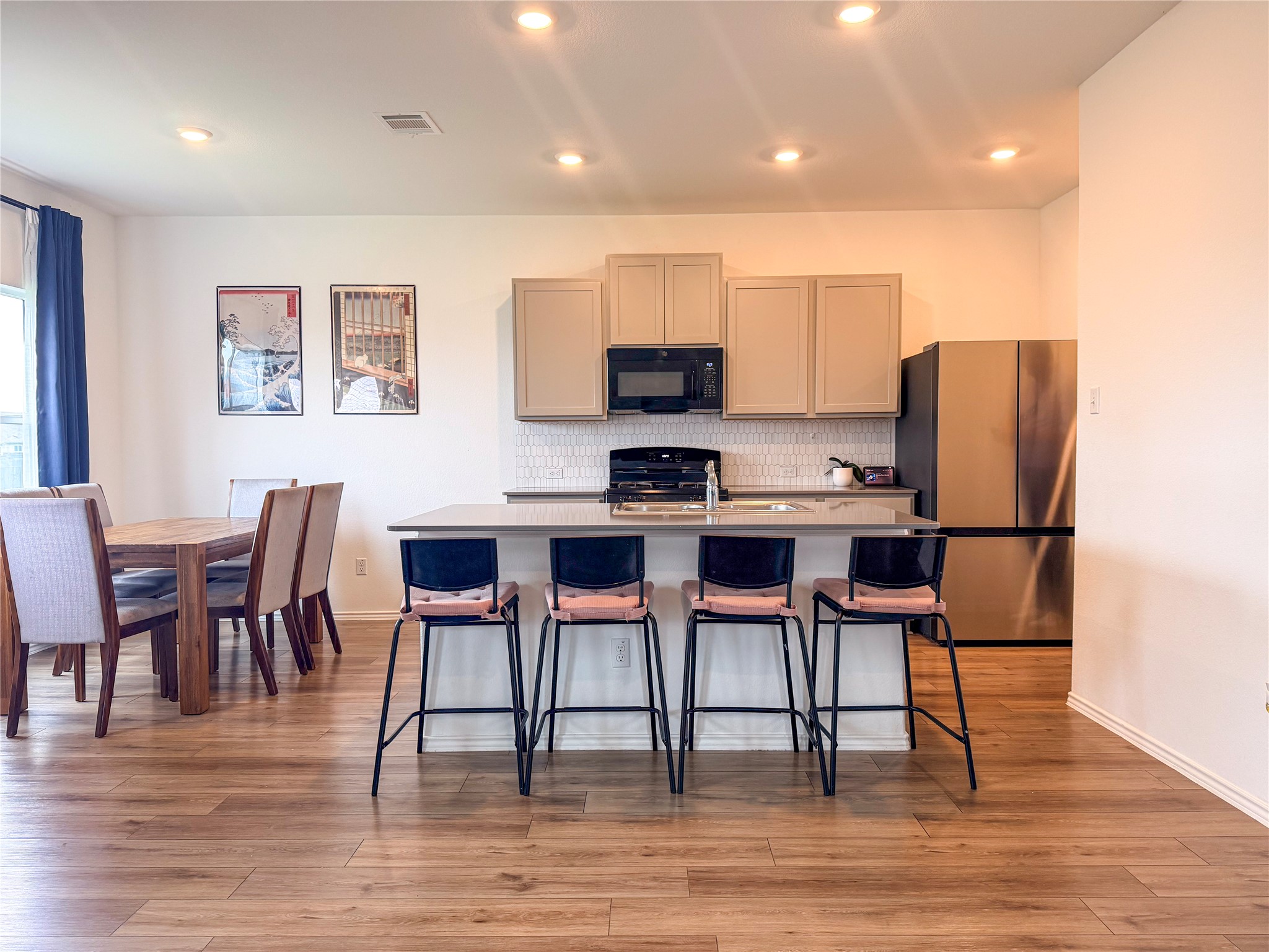 400 Canley Loop Hutto, TX 78634 - Photo 7 of 20 a view of kitchen with cabinets table and chairs