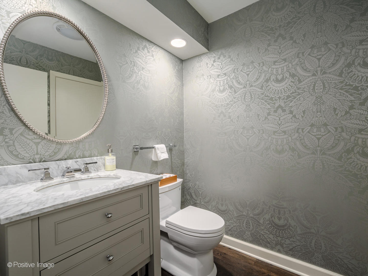 2775 Sheridan Road Evanston, IL 60201 - Photo 15 of 27 a bathroom with a granite countertop toilet a sink and mirror