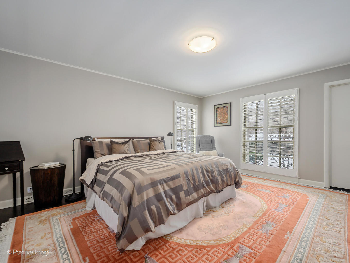 2775 Sheridan Road Evanston, IL 60201 - Photo 19 of 27 a bedroom with a large bed and wooden floor