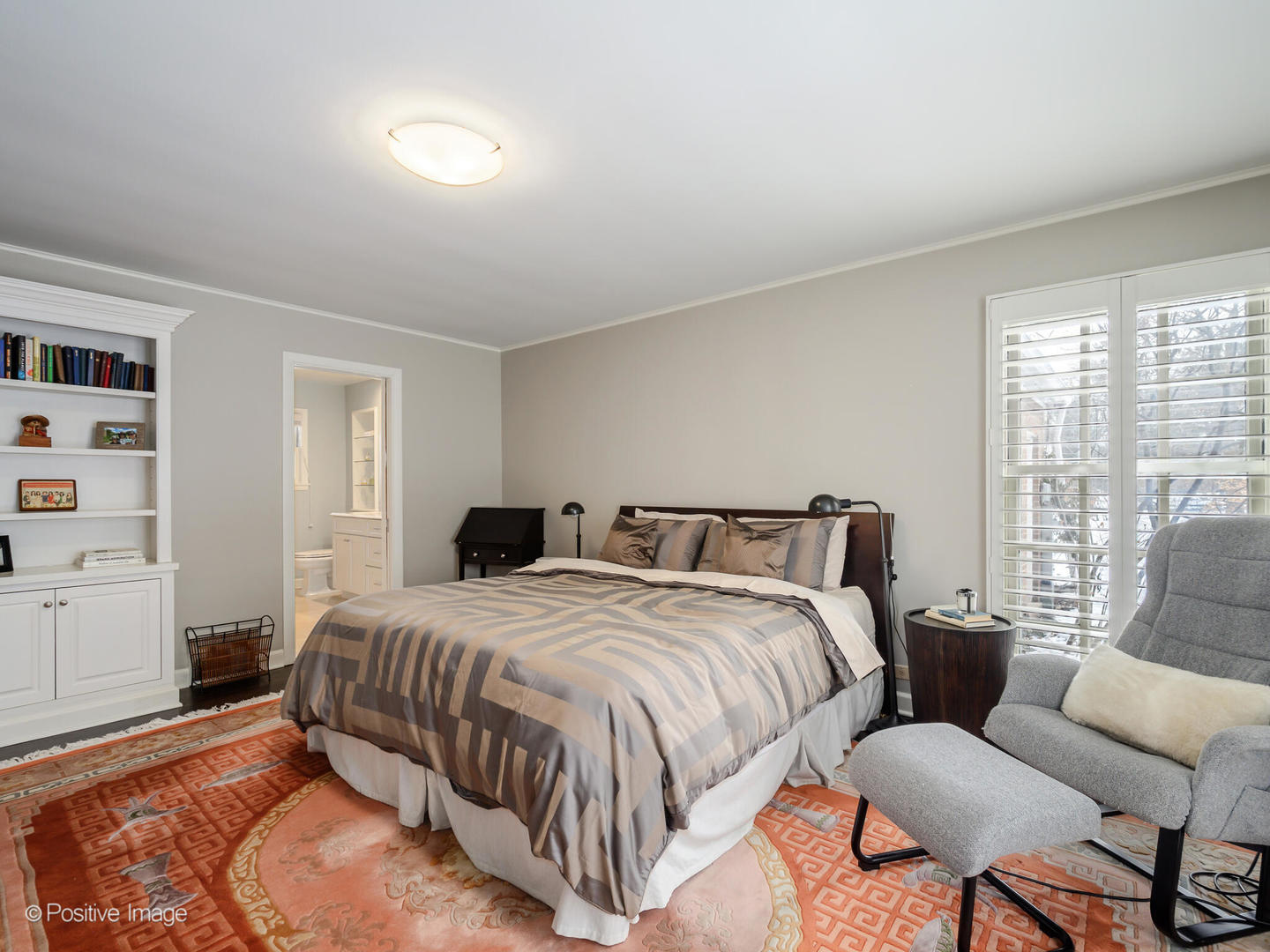 2775 Sheridan Road Evanston, IL 60201 - Photo 20 of 27 a spacious bedroom with a bed a couch and a window