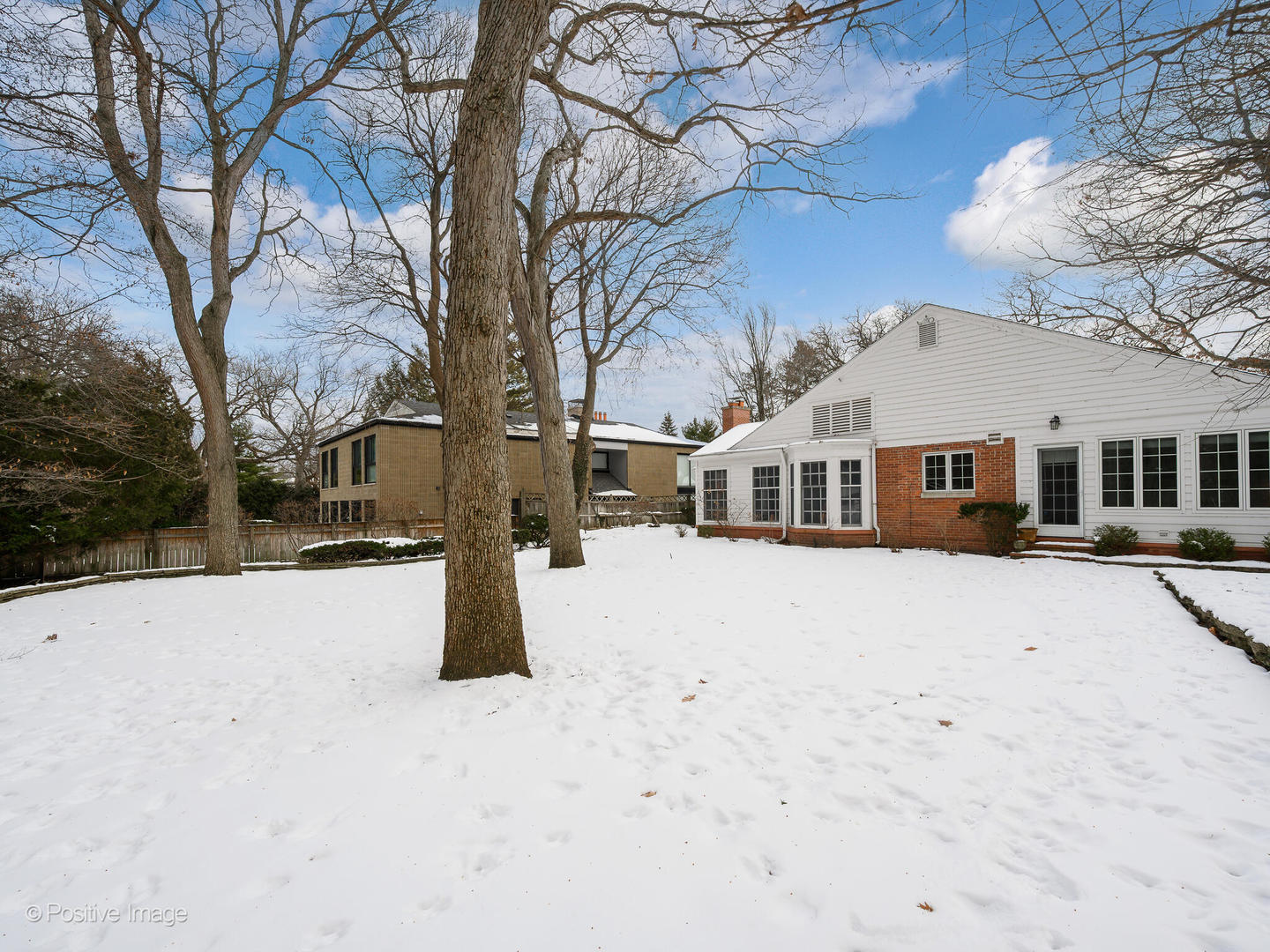 2775 Sheridan Road Evanston, IL 60201 - Photo 25 of 27 a front view of a house with a yard covered in snow