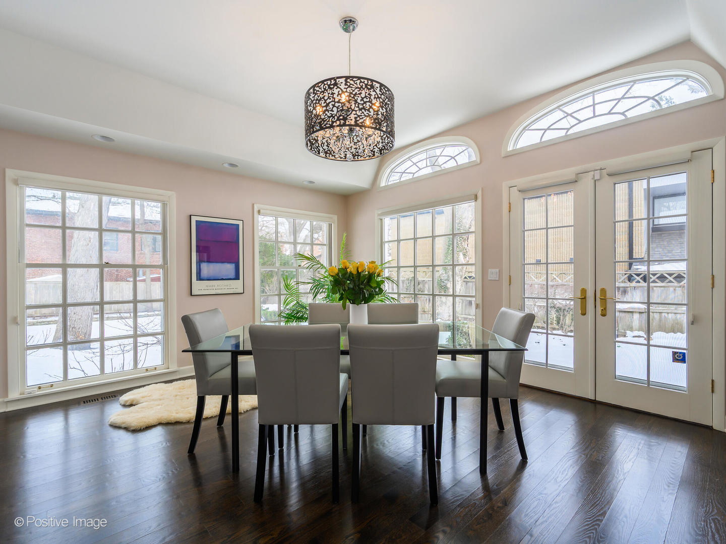 2775 Sheridan Road Evanston, IL 60201 - Photo 8 of 27 a view of a dining room with furniture a chandelier and wooden floor