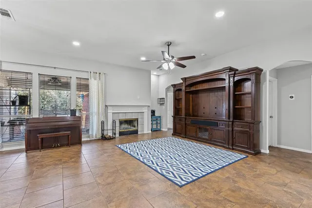 a view of livingroom with furniture fireplace and window