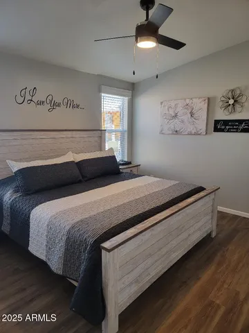 a bedroom with bed and window