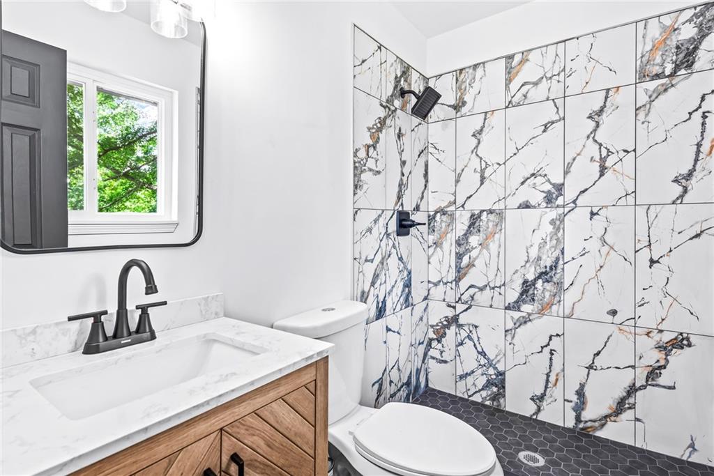 264 Howell Terrace Southwest Atlanta, GA 30331 - Photo 12 of 17 a bathroom with a sink and a toilet