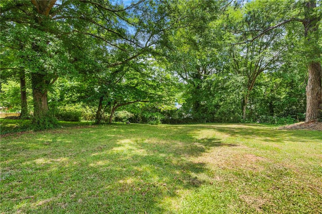 264 Howell Terrace Southwest Atlanta, GA 30331 - Photo 14 of 17 a view of a field with trees in the background
