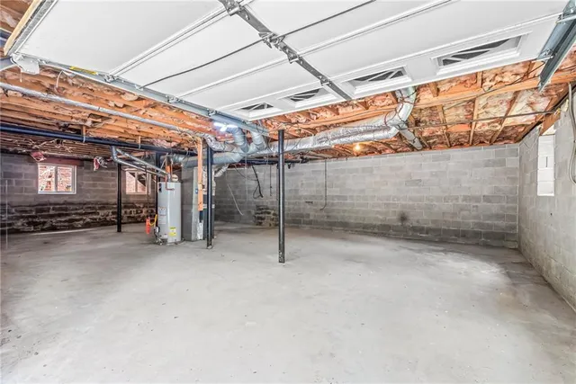 a view of empty room with wooden walls