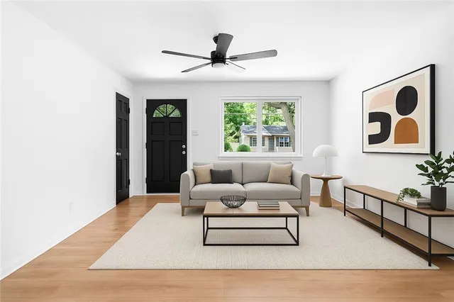 a living room with furniture and window