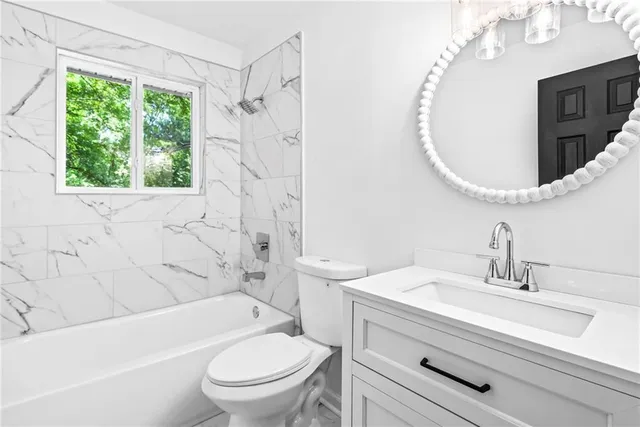 a bathroom with a sink a toilet and a bathtub