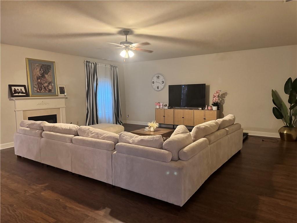 114 Crescent Woode Way Dallas, GA 30157 - Photo 11 of 25 a living room with furniture and a flat screen tv