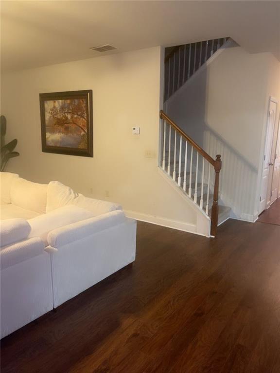 114 Crescent Woode Way Dallas, GA 30157 - Photo 20 of 25 a bedroom with a bed and wooden floor