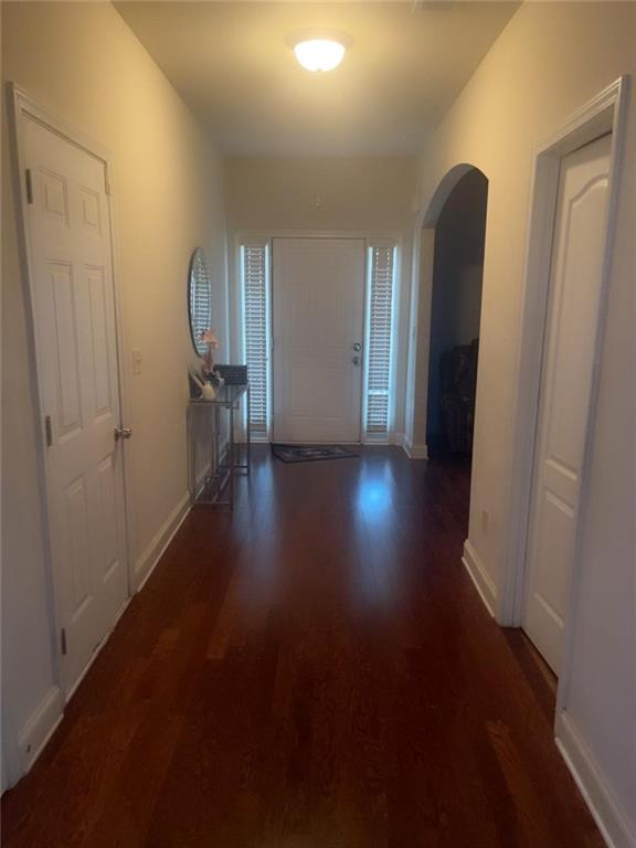 114 Crescent Woode Way Dallas, GA 30157 - Photo 23 of 25 an empty room with wooden floor and windows