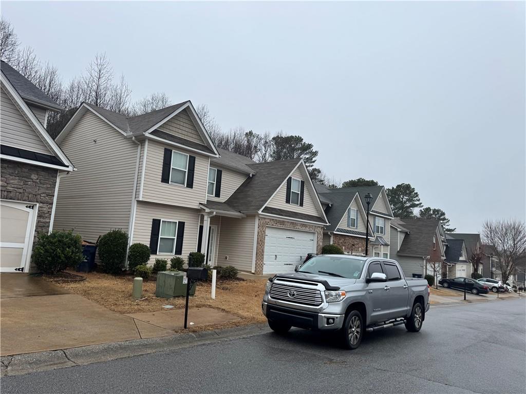 114 Crescent Woode Way Dallas, GA 30157 - Photo 6 of 25 a car parked in front of a house