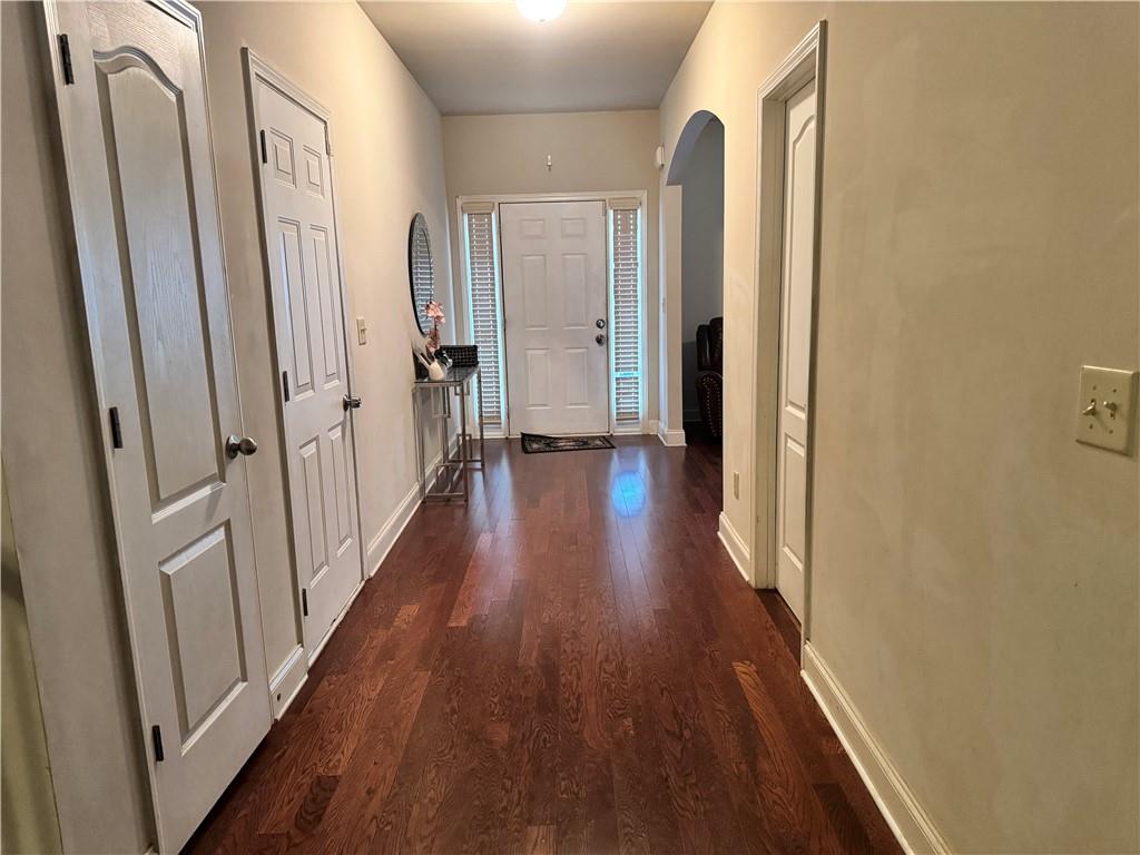 114 Crescent Woode Way Dallas, GA 30157 - Photo 9 of 25 a view of a hallway with wooden floor