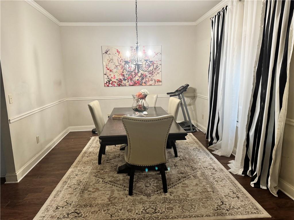 114 Crescent Woode Way Dallas, GA 30157 - Photo 10 of 25 a dining room with furniture a rug and wooden floor