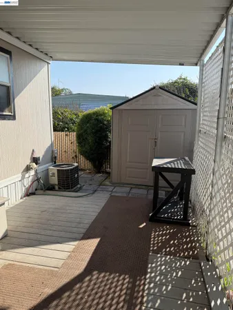 a view of a chairs and a table in the patio