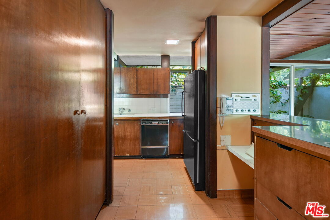 1335 Shadybrook Drive Beverly Hills, CA 90210 - Photo 15 of 39 a view of a kitchen with a large window
