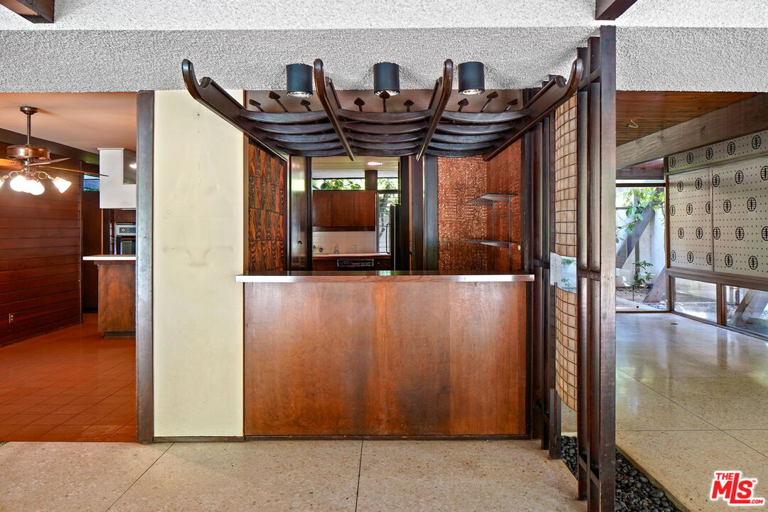 1335 Shadybrook Drive Beverly Hills, CA 90210 - Photo 17 of 39 a view of a patio with a table and chairs