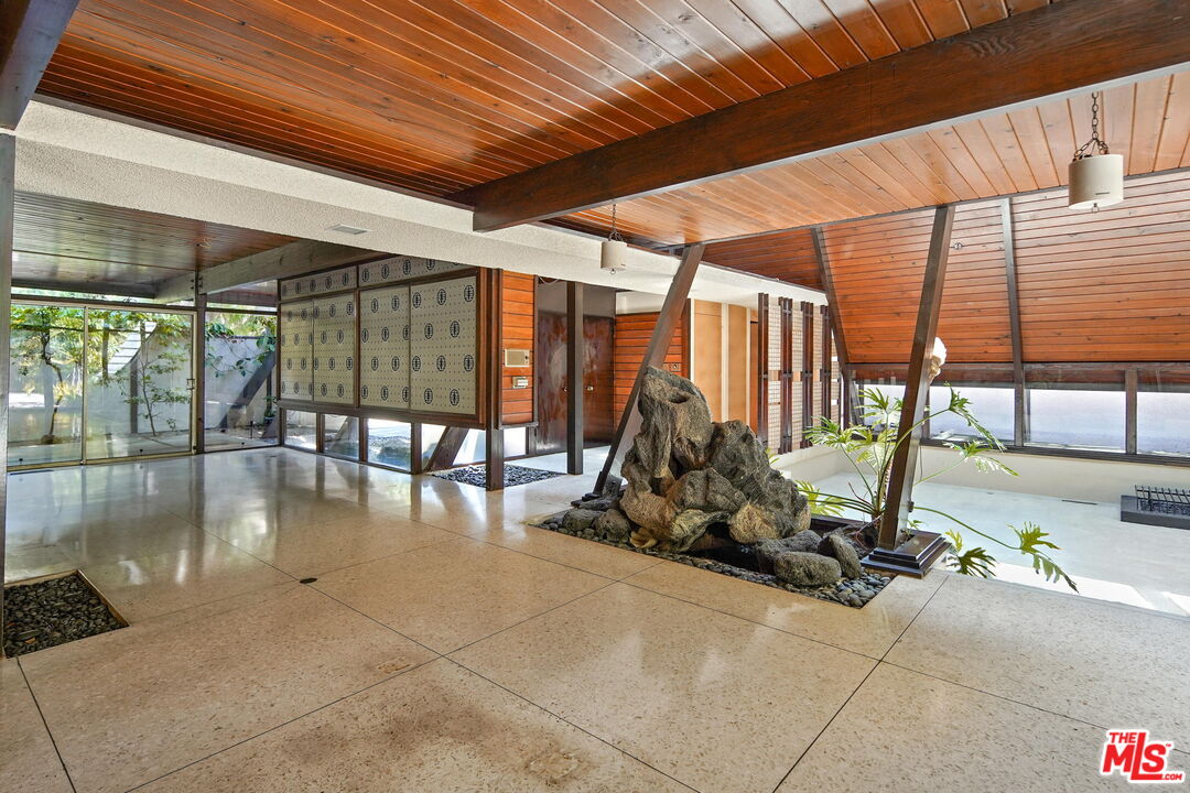 1335 Shadybrook Drive Beverly Hills, CA 90210 - Photo 19 of 39 a view of a room with gym equipment