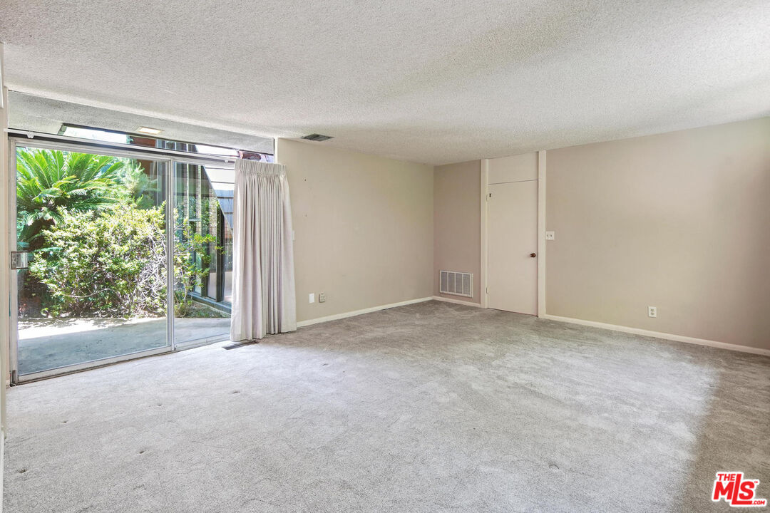 1335 Shadybrook Drive Beverly Hills, CA 90210 - Photo 25 of 39 a view of an empty room with a window