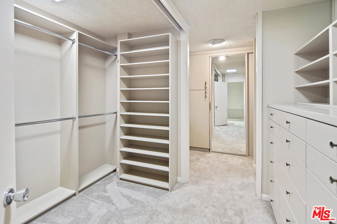 1335 Shadybrook Drive Beverly Hills, CA 90210 - Photo 28 of 39 a view of closet area with empty racks