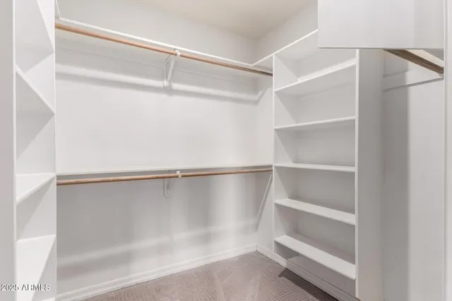a view of an empty walk in closet