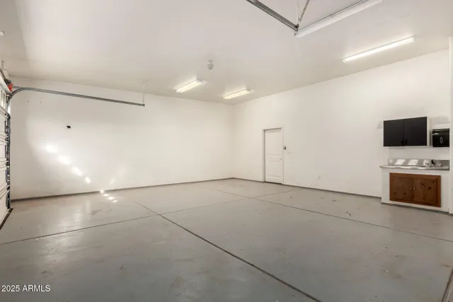 a view of an empty room with a fireplace