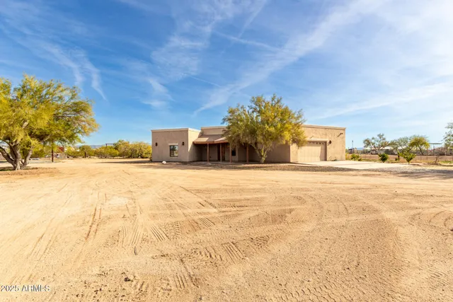 a house with trees in the background