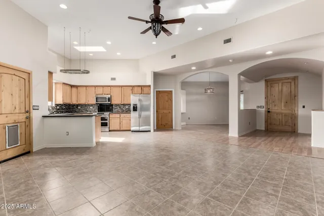 a view of a yard with a tree