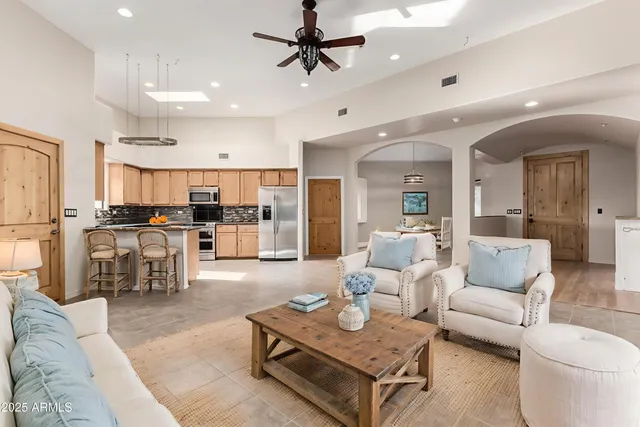 a view of a kitchen with a sink and cabinets