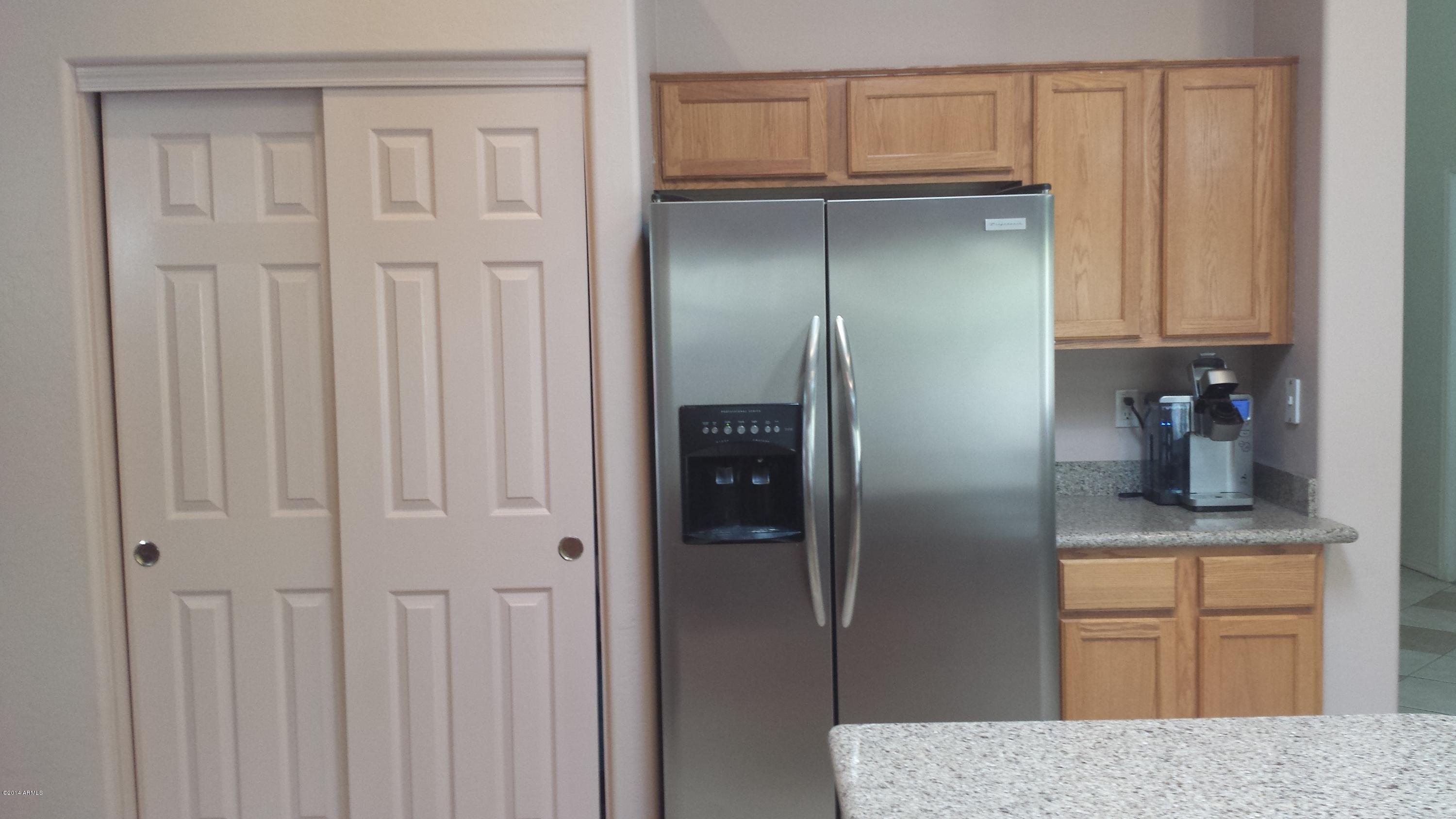 11030 West Granada Road Avondale, AZ 85392 - Photo 11 of 49 Kitchen pantry & ss steel refrigerator