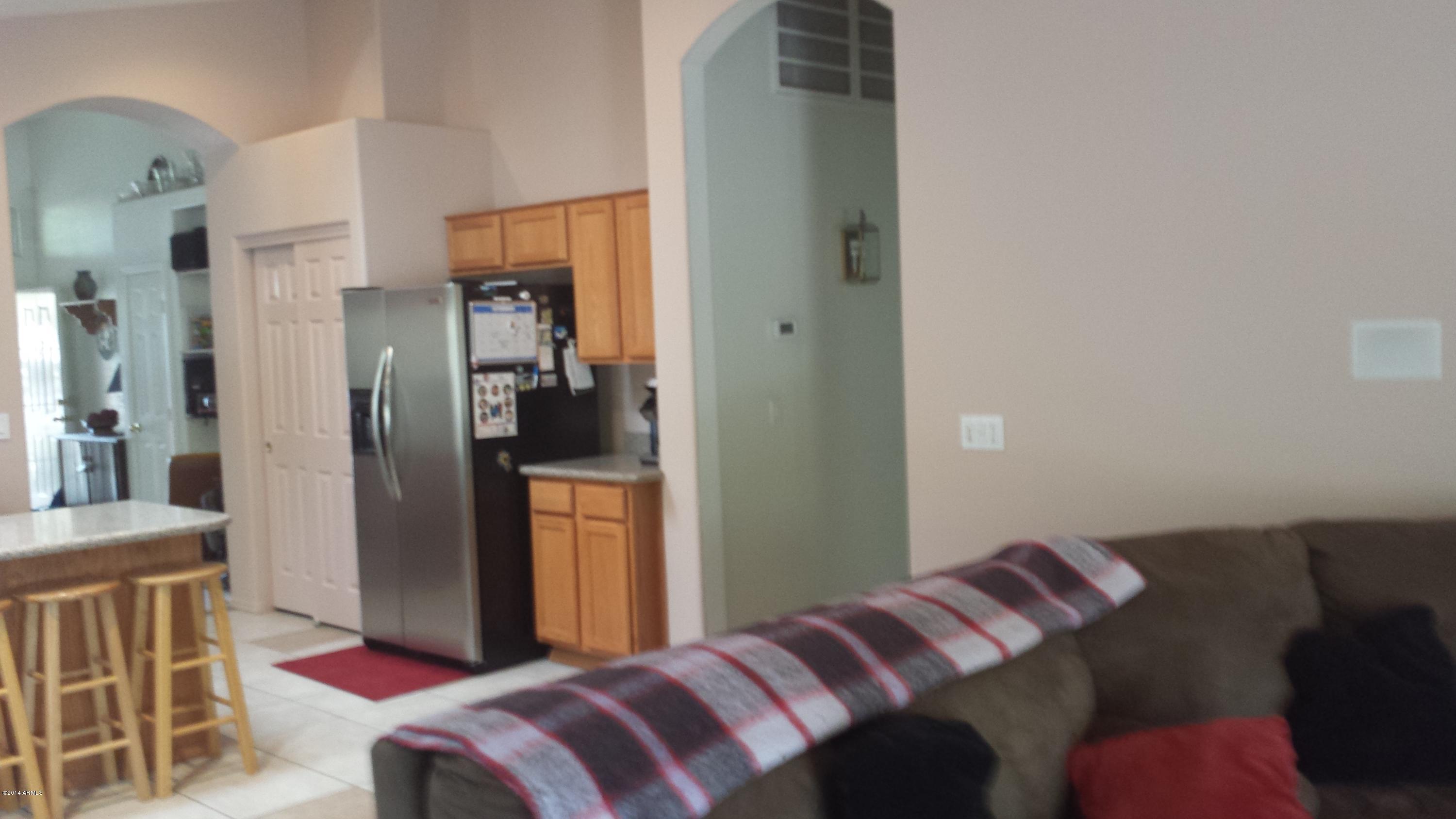 11030 West Granada Road Avondale, AZ 85392 - Photo 13 of 49 Family room To Kitchen