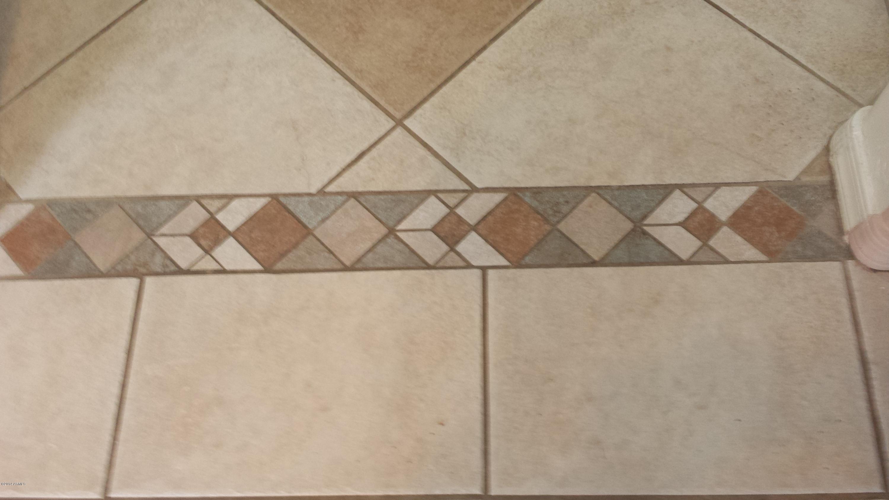 11030 West Granada Road Avondale, AZ 85392 - Photo 14 of 49 Transition Tile Kit. to Bdrm Hallway