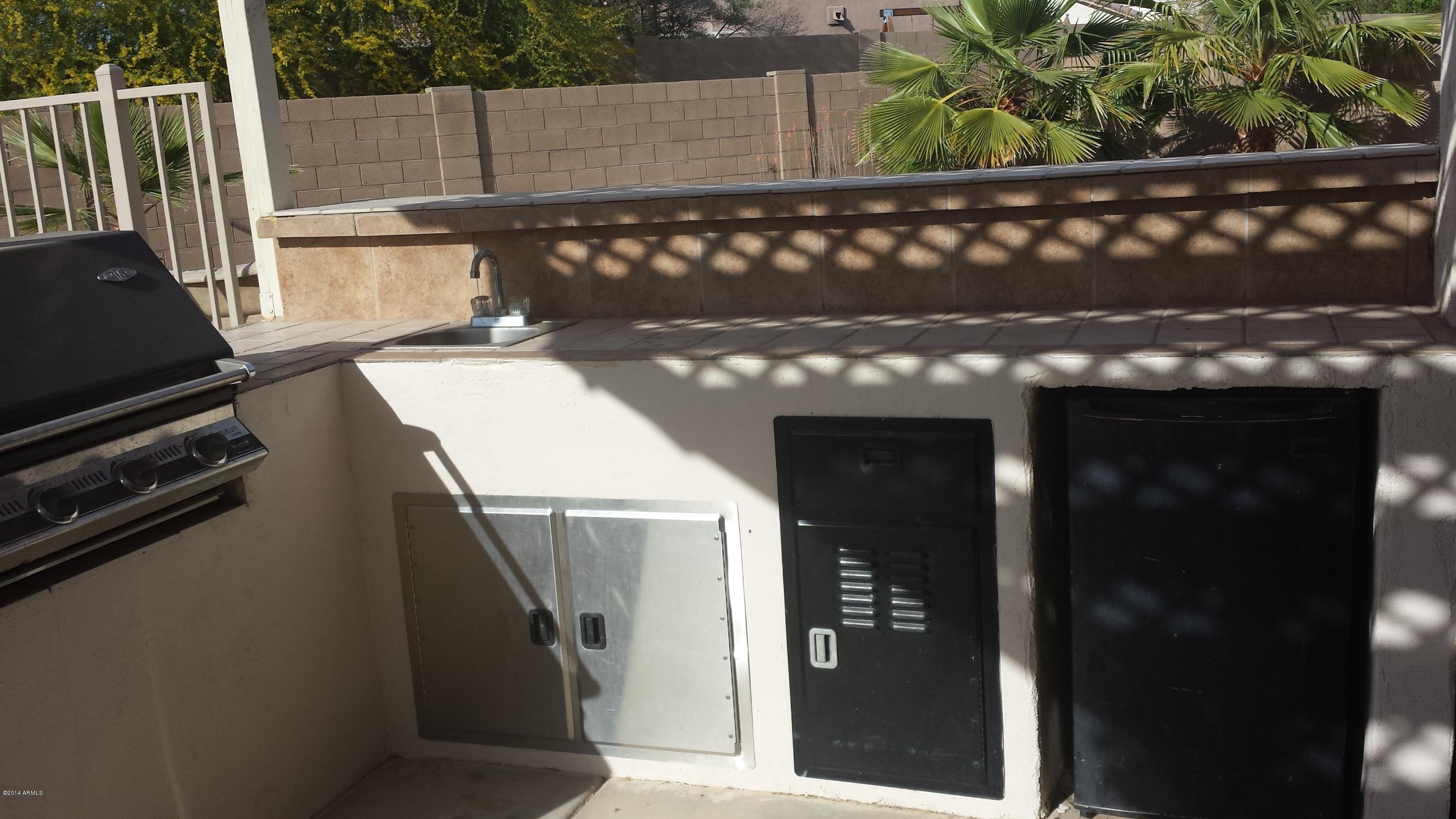 11030 West Granada Road Avondale, AZ 85392 - Photo 42 of 49 Built in BBQ w/ bar sink & small ref.