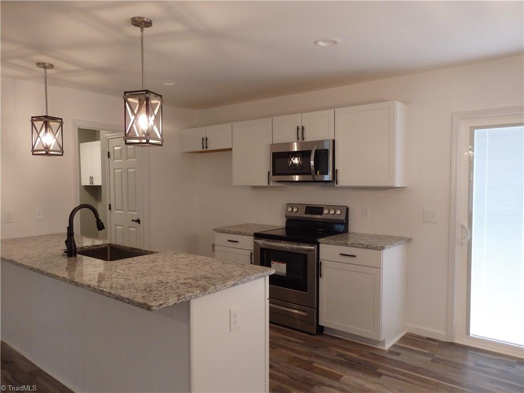 251 Bescher Chapel Road Trinity, NC 27370 - Photo 6 of 15 Kitchen with granite counter tops