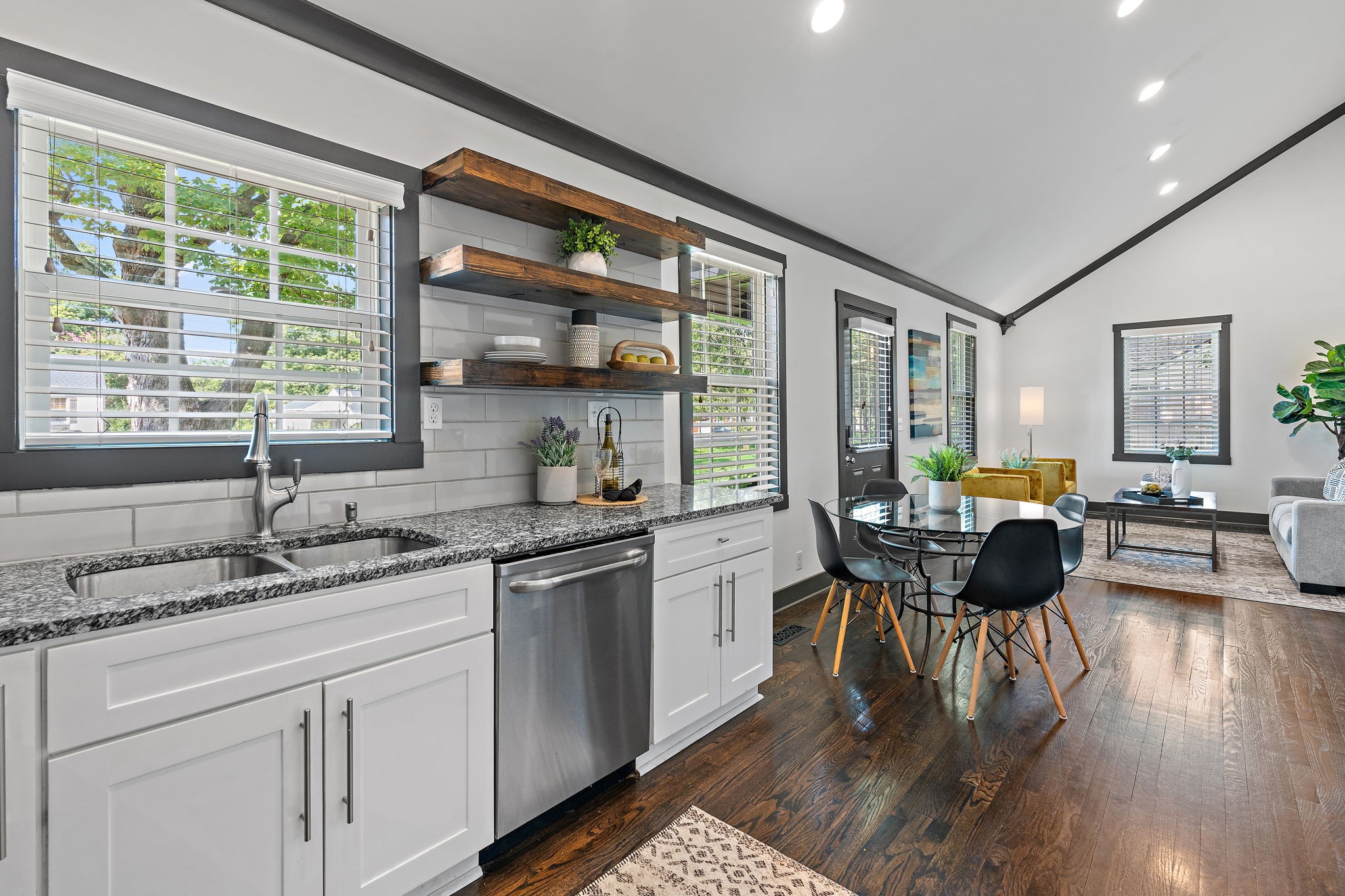 2614 Live Oak Road Nashville, TN 37210 - Photo 12 of 37 a kitchen with a table chairs stove and wooden floor
