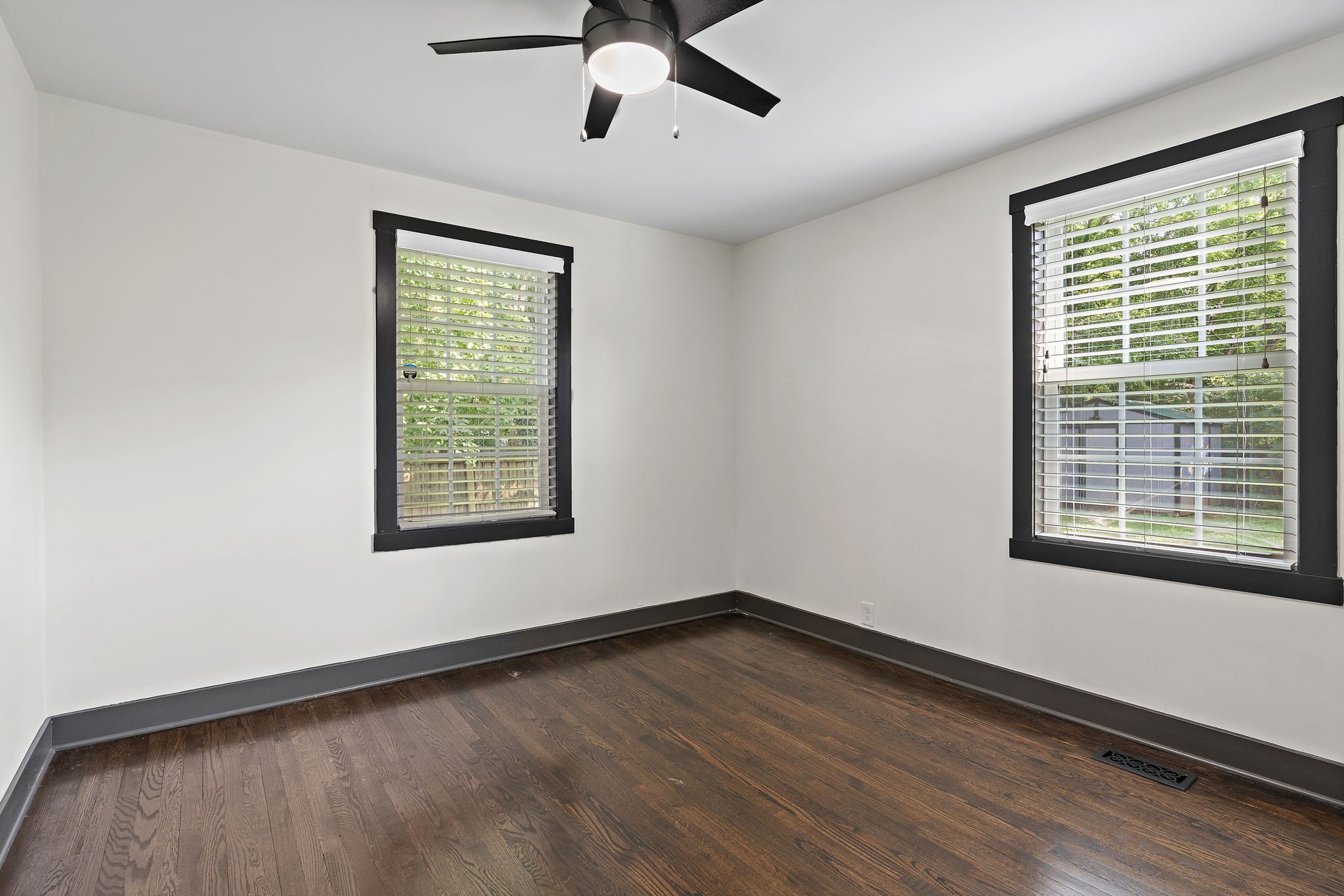 2614 Live Oak Road Nashville, TN 37210 - Photo 16 of 37 a view of an empty room with a window and wooden floor