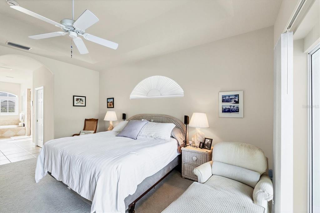 4 Windward Way Placida, FL 33946 - Photo 24 of 39 a bedroom with a bed and a couch