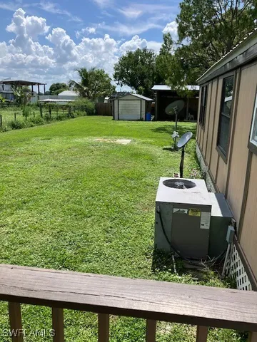 a view of a backyard with sitting area