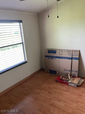 a room with gym equipment and a window