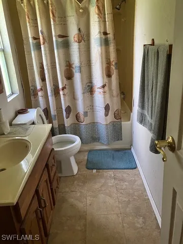 a bathroom with a sink and toilet